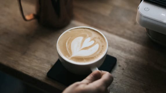Cup of coffee on a table.